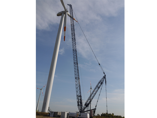 Large crane by windmill